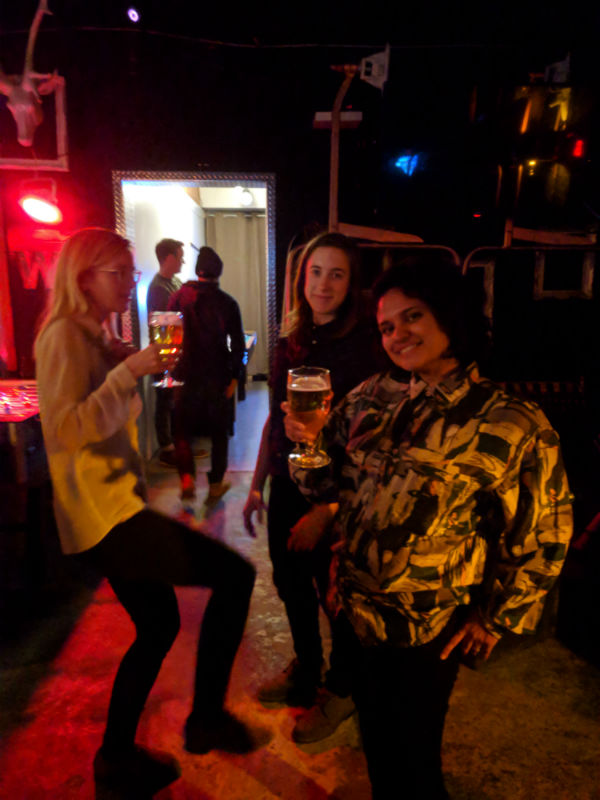 photo of three pepole at a bar