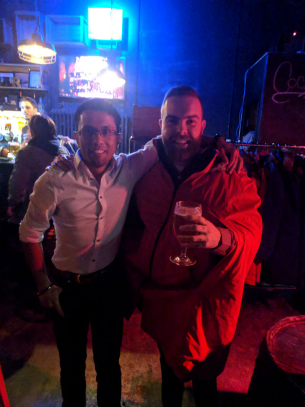 photo of two people at a bar