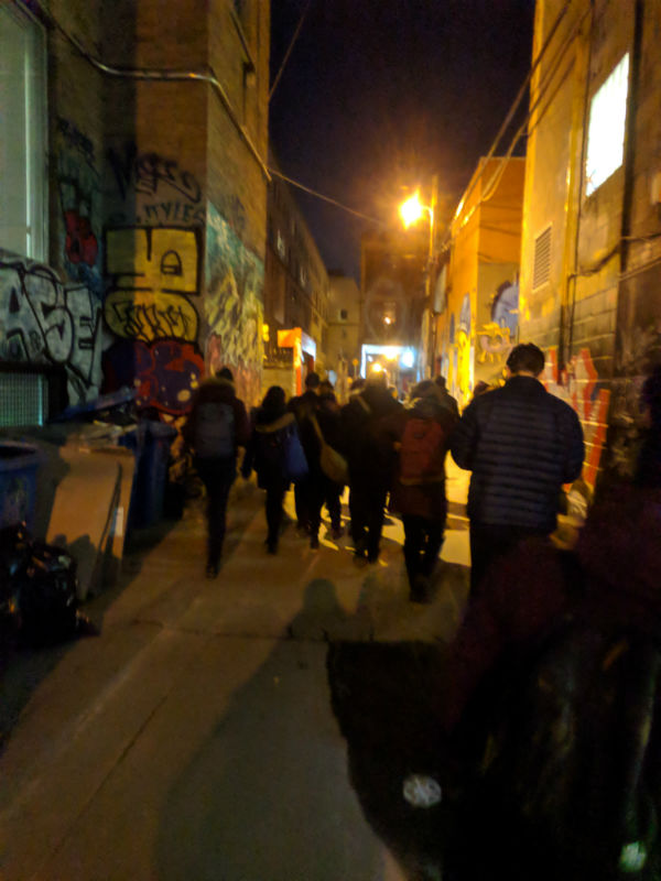 photo of people in grafitti alley
